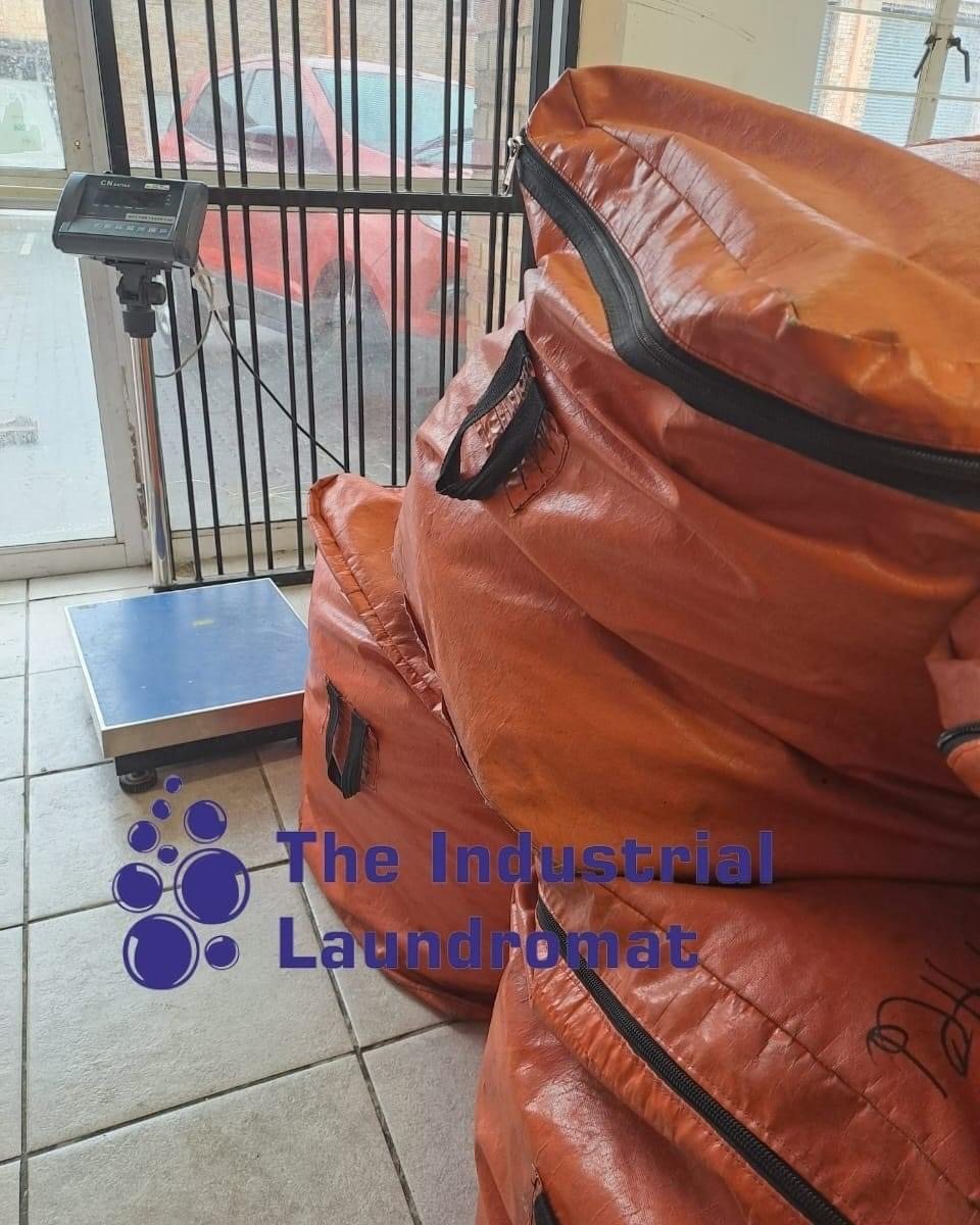 Bulk laundry bags ready to be weighed and processed